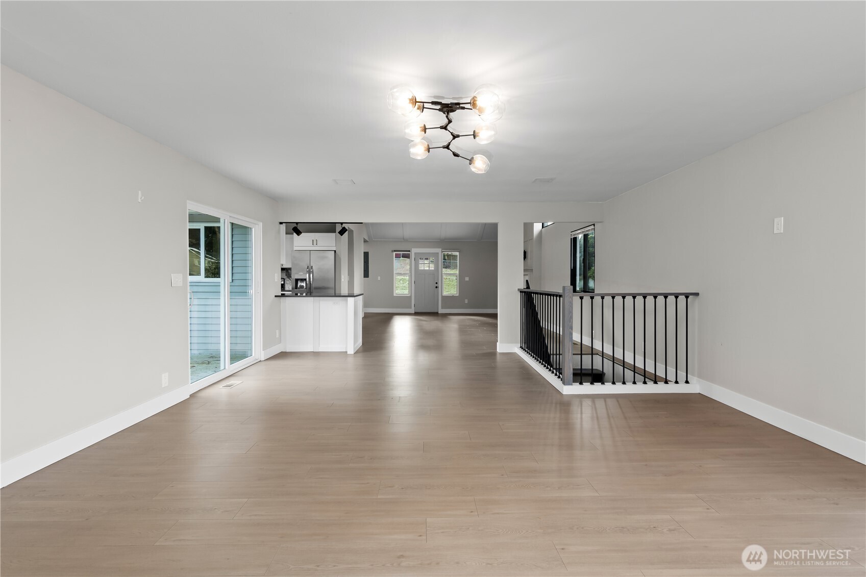 625 173rd Street South Spanaway, WA 98387 - Photo 13 of 35 a view interior of a house with wooden floor windows and a kitchen
