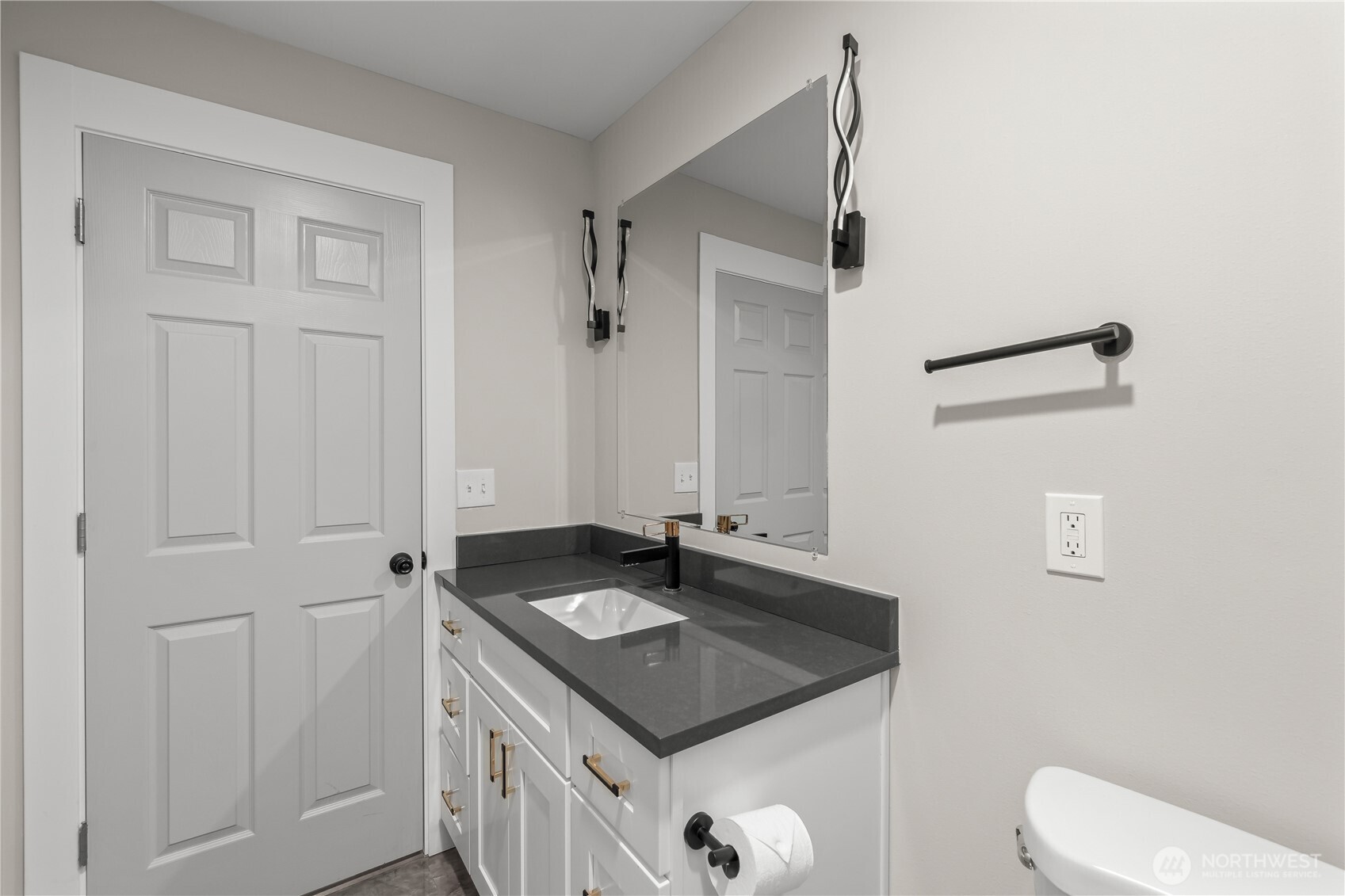 625 173rd Street South Spanaway, WA 98387 - Photo 23 of 35 a bathroom with a sink a toilet and a mirror