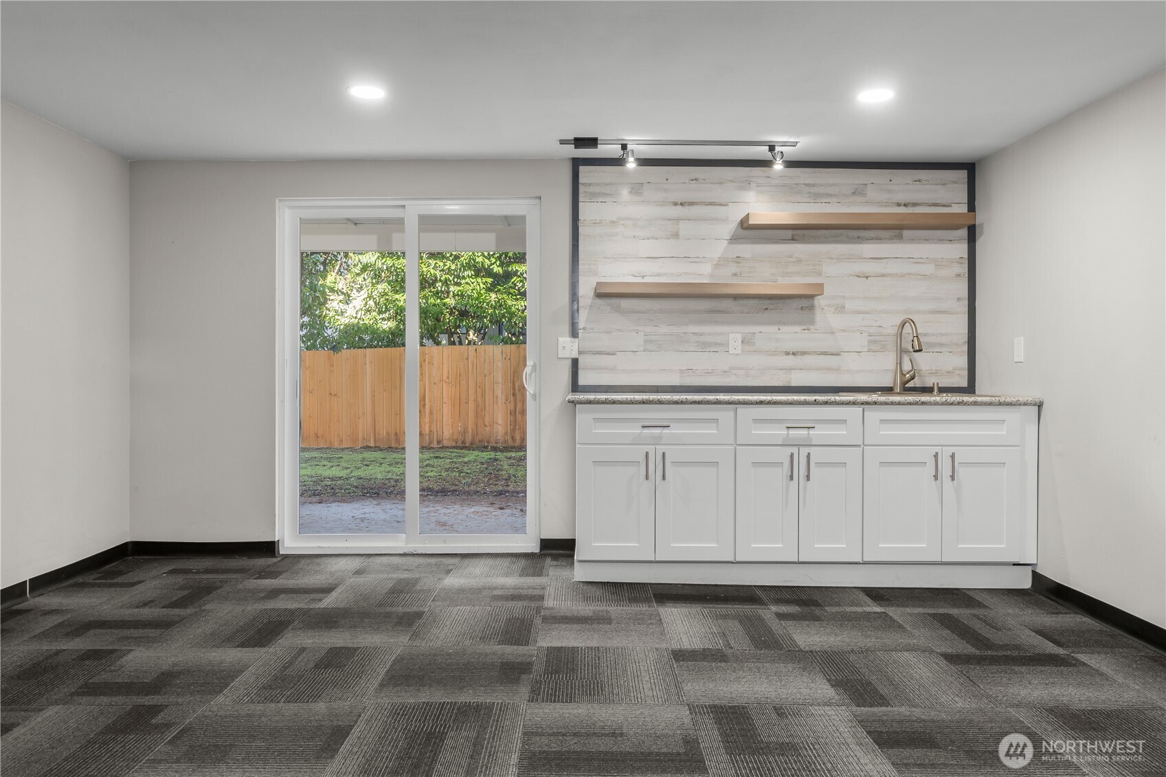 625 173rd Street South Spanaway, WA 98387 - Photo 29 of 35 a view of a refrigerator in kitchen and an empty room