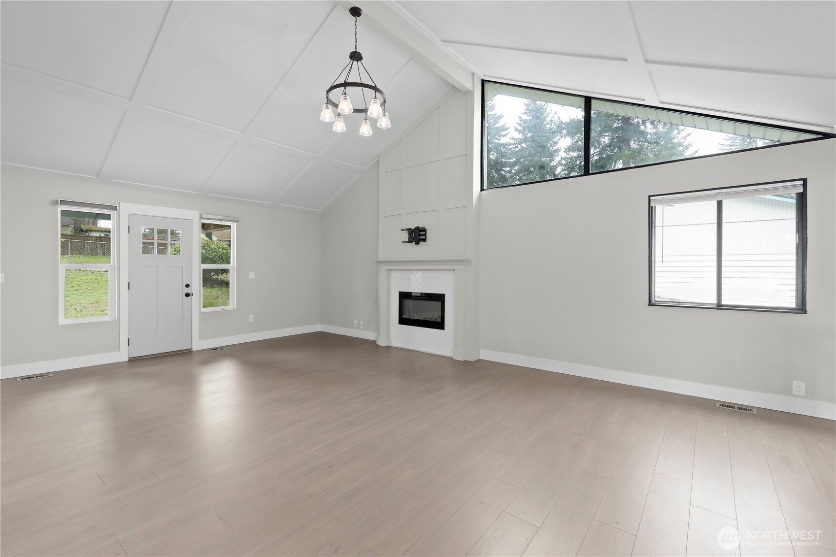 625 173rd Street South Spanaway, WA 98387 - Photo 3 of 35 an empty room with wooden floor and windows