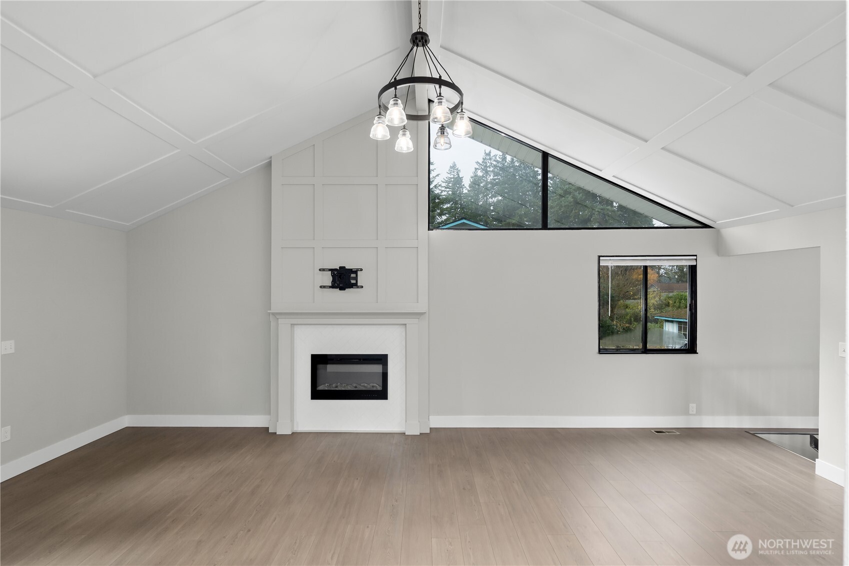 625 173rd Street South Spanaway, WA 98387 - Photo 5 of 35 an empty room with wooden floor fan and windows
