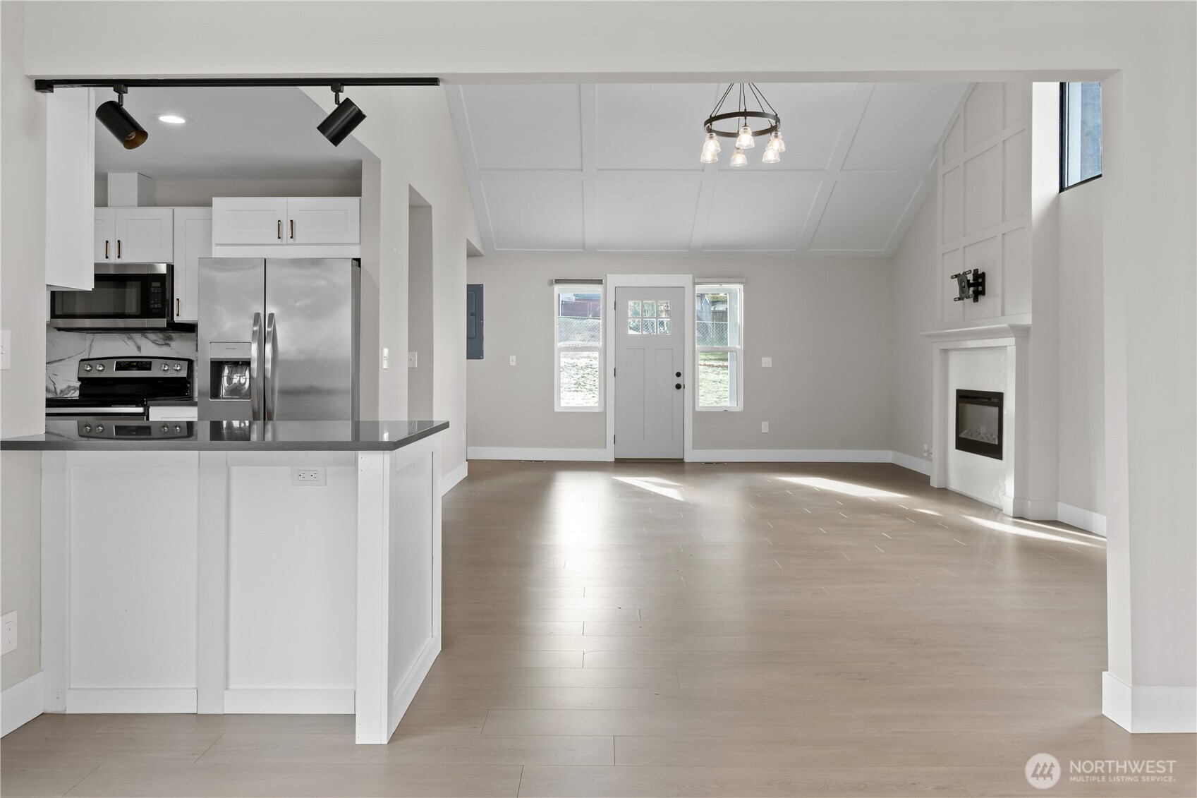 625 173rd Street South Spanaway, WA 98387 - Photo 10 of 35 a view of a kitchen with a stove and a refrigerator