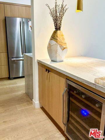 a kitchen with a refrigerator and countertop