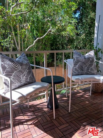 a patio with table and chairs