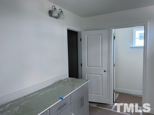 16 Nailsworth Street Angier, NC 27501 - Photo 8 of 11 a bathroom with a granite countertop sink and vanity