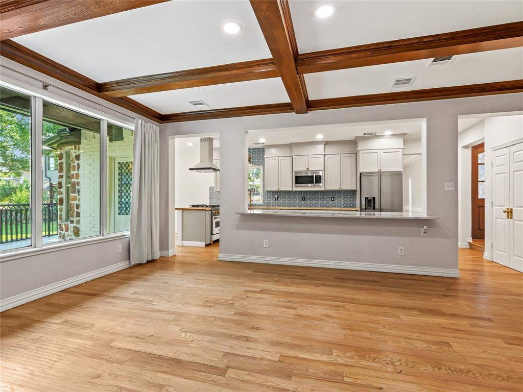 153 Meadowcreek Road Coppell, TX 75019 - Photo 15 of 35 Unfurnished living room with light wood finished floors, recessed lighting, coffered ceiling, and ornamental molding