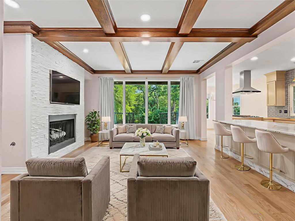 153 Meadowcreek Road Coppell, TX 75019 - Photo 21 of 35 Living room featuring coffered ceiling, light wood finished floors, healthy amount of natural light, recessed lighting, and a large fireplace
