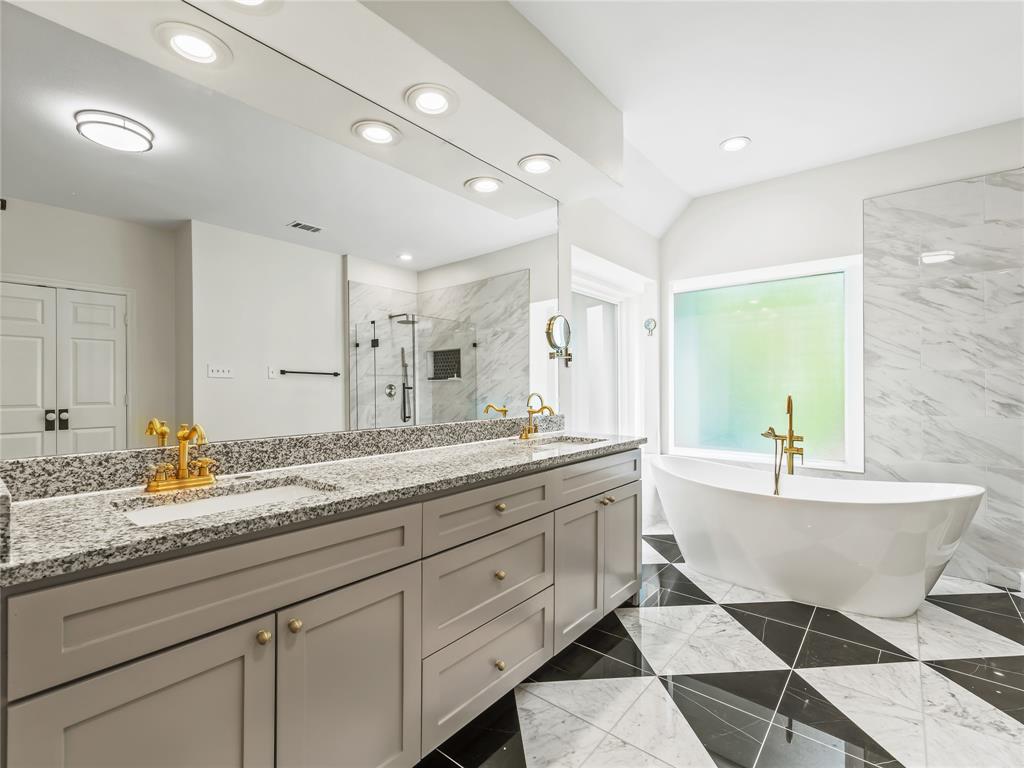 153 Meadowcreek Road Coppell, TX 75019 - Photo 27 of 35 Bathroom with double vanity, a shower stall, a freestanding tub, recessed lighting, and light marble finish floors