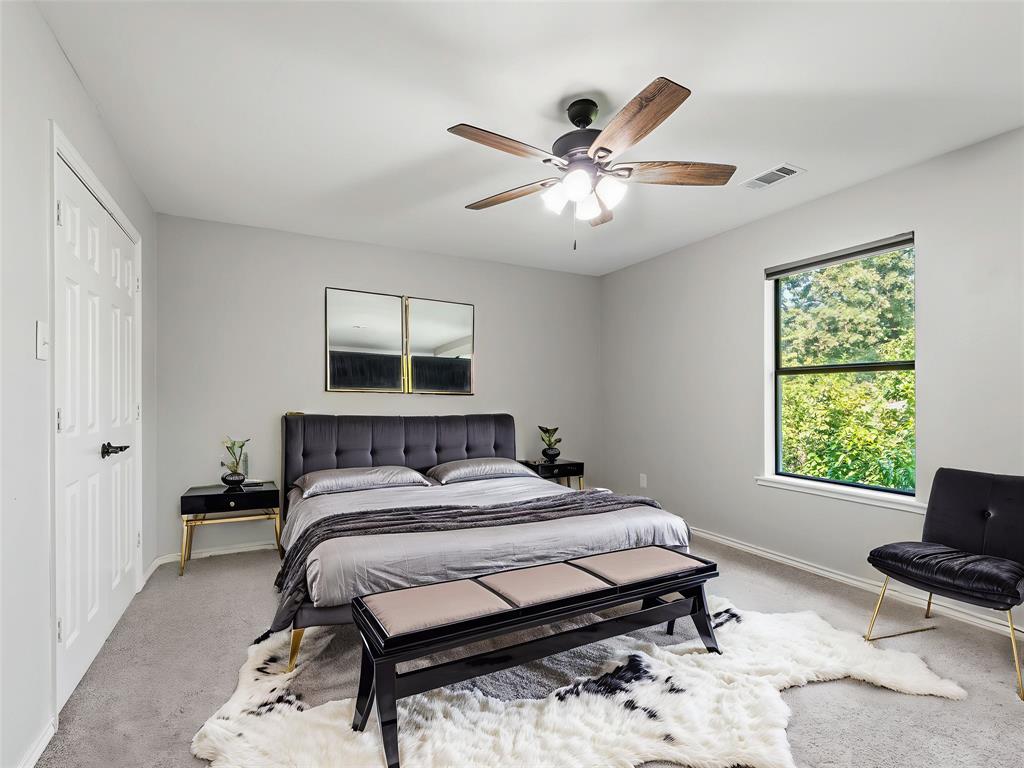 153 Meadowcreek Road Coppell, TX 75019 - Photo 29 of 35 Carpeted bedroom featuring a closet and ceiling fan