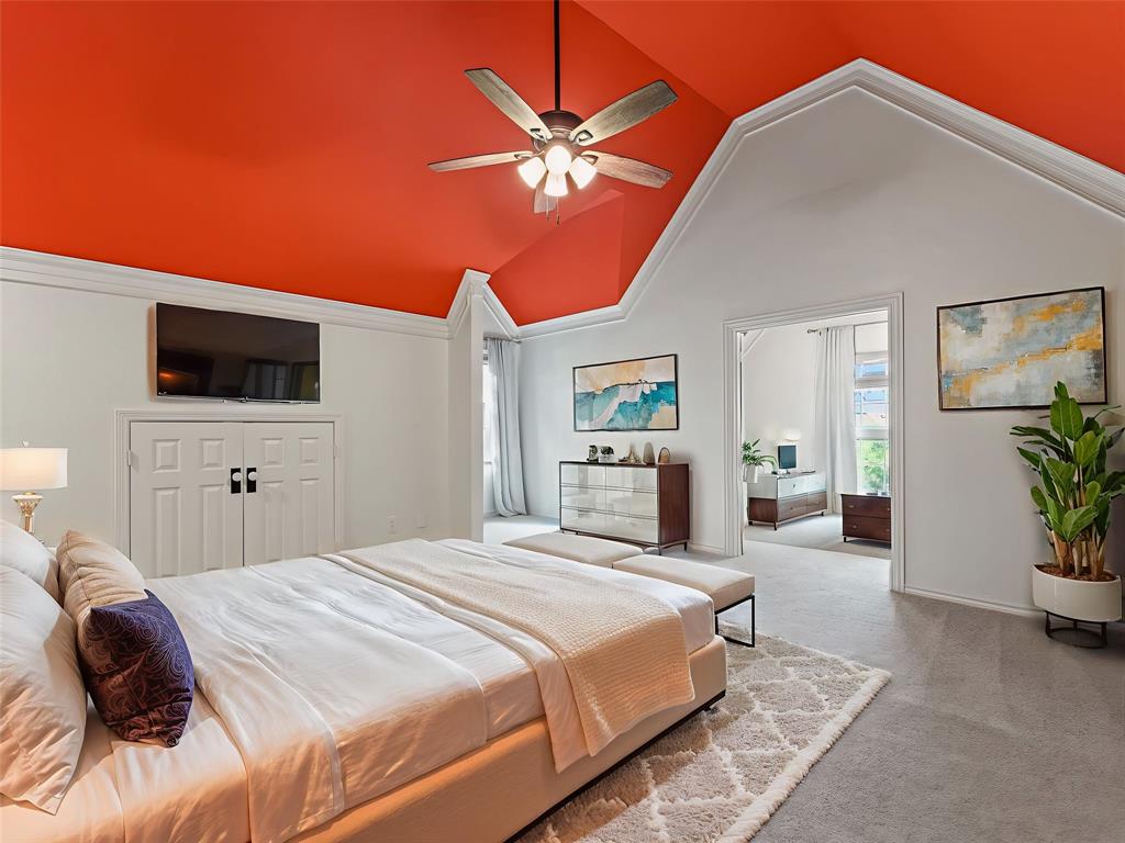 153 Meadowcreek Road Coppell, TX 75019 - Photo 30 of 35 Carpeted bedroom with vaulted ceiling and ceiling fan