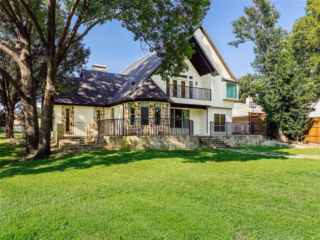 153 Meadowcreek Road Coppell, TX 75019 - Photo 35 of 35 Back of house featuring a patio, a balcony, stone siding, and a chimney