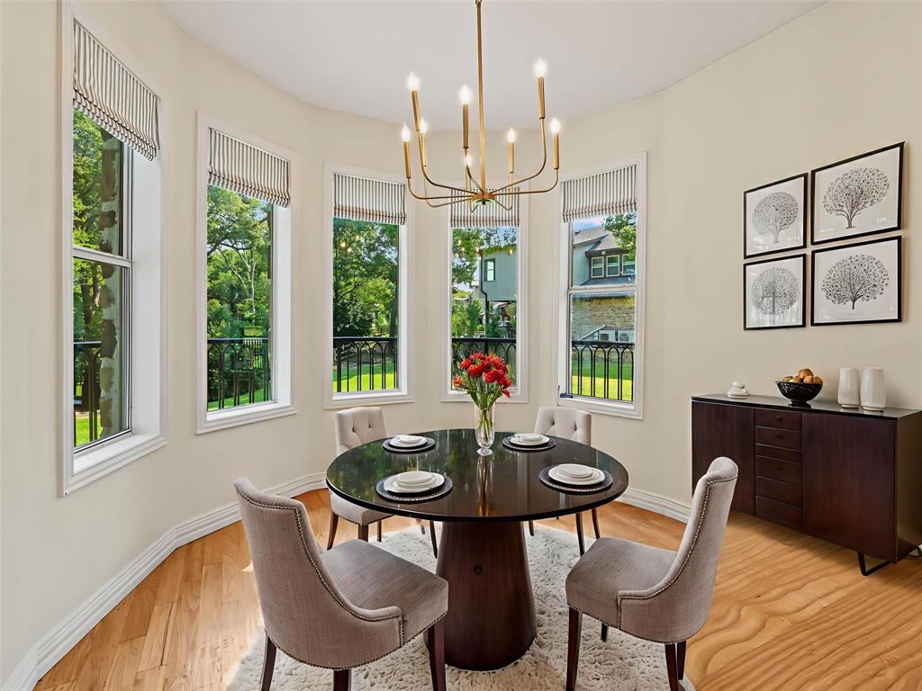 153 Meadowcreek Road Coppell, TX 75019 - Photo 10 of 35 Dining space with suspended lighting and light wood-type flooring