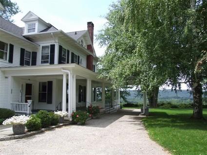 406-396 Sharon Road Salisbury, CT 06039 - Photo 13 of 20 a front view of a house with garden
