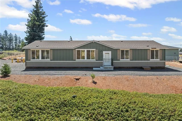 a front view of a house with yard