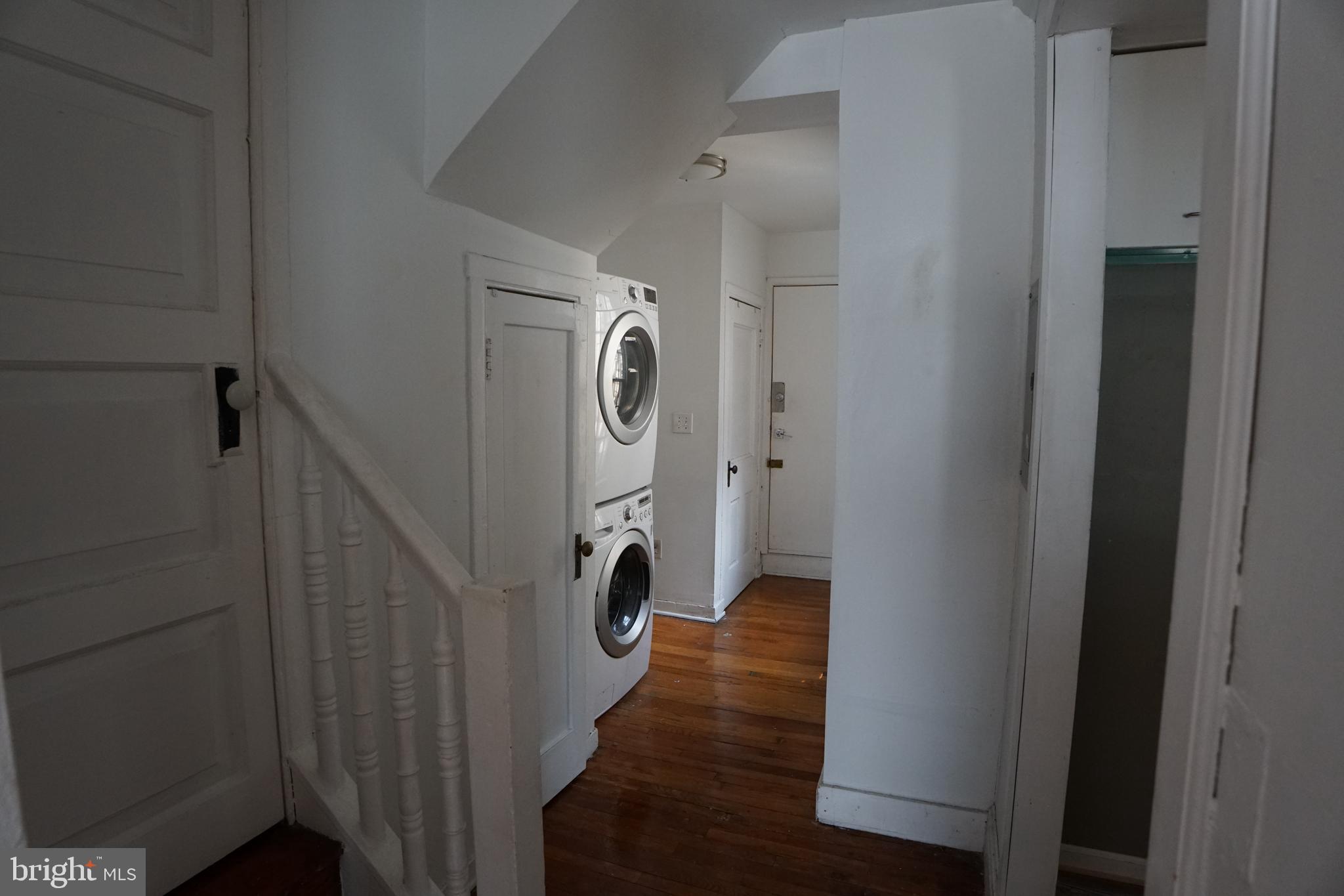 802 Cathedral Street, Unit 4 Baltimore, MD 21201 - Photo 4 of 15 a view of a hallway with wooden floor