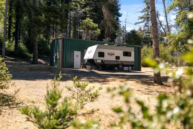 a view of a house with snow on the background
