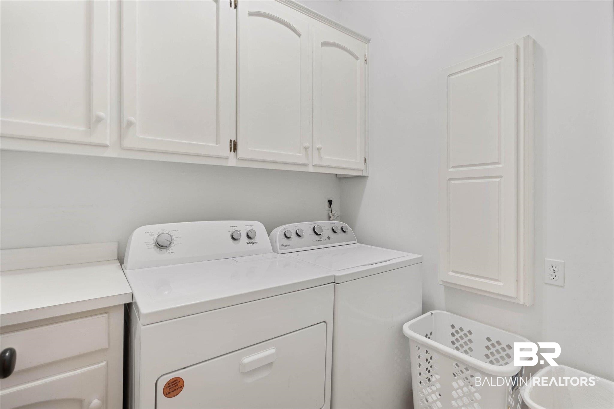 3615 Stein Street Mobile, AL 36608 - Photo 32 of 44 Laundry room featuring washing machine and dryer and cabinet space