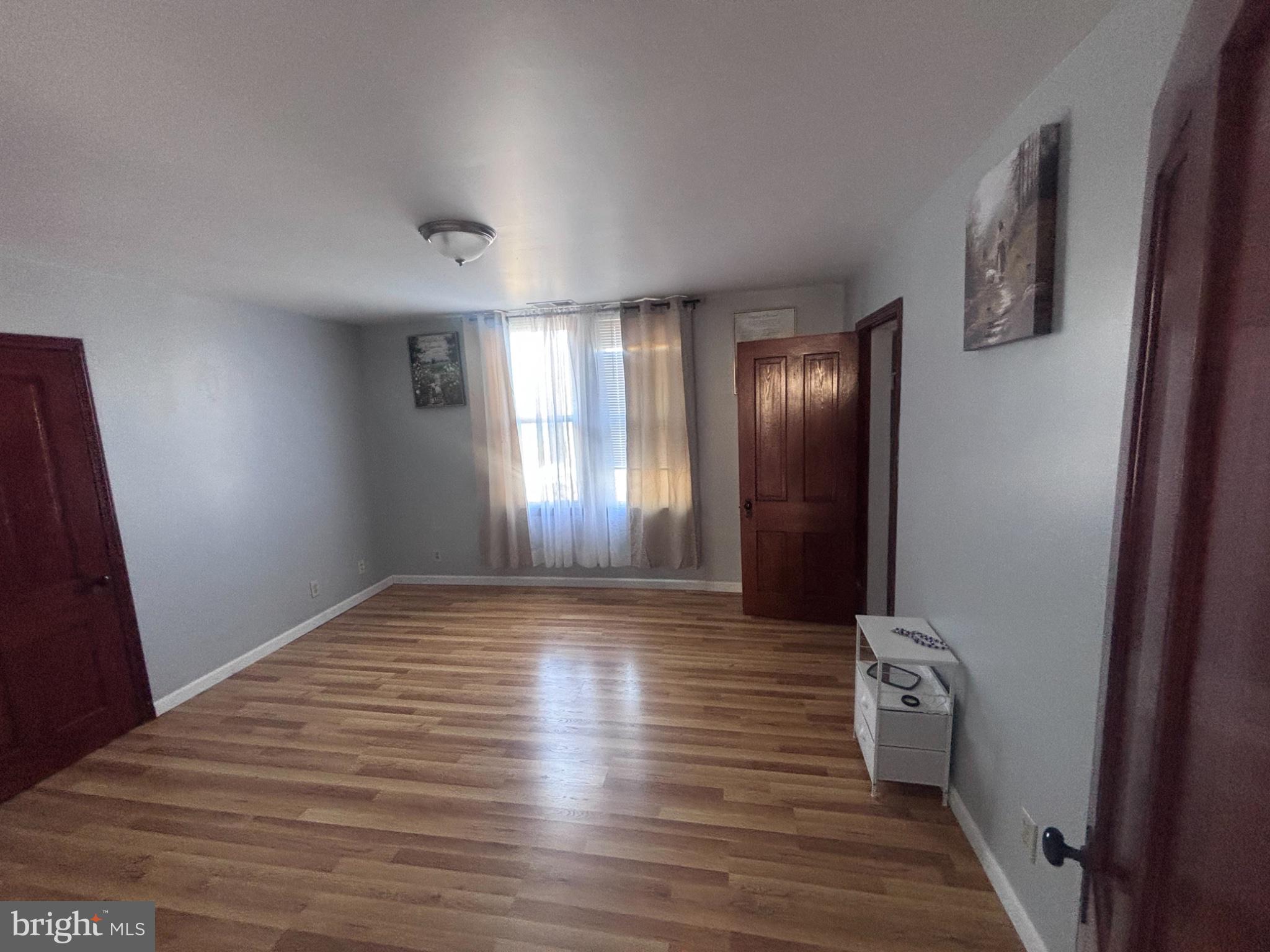 151 Howard Avenue Halethorpe, MD 21227 - Photo 15 of 21 Bright and airy room with warm tones.
