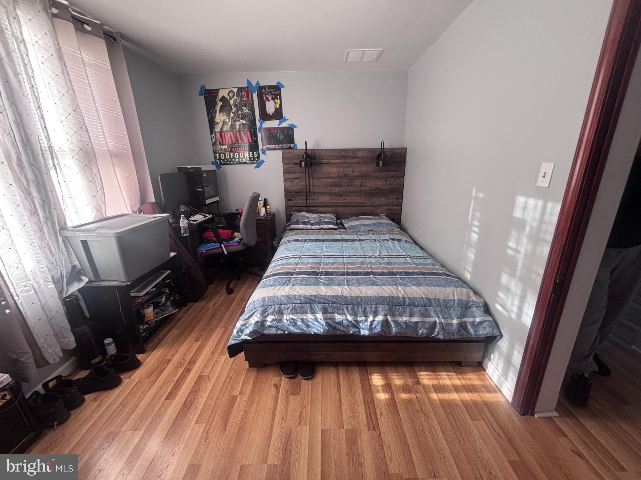 151 Howard Avenue Halethorpe, MD 21227 - Photo 16 of 21 Cozy bedroom with warm wooden accents.