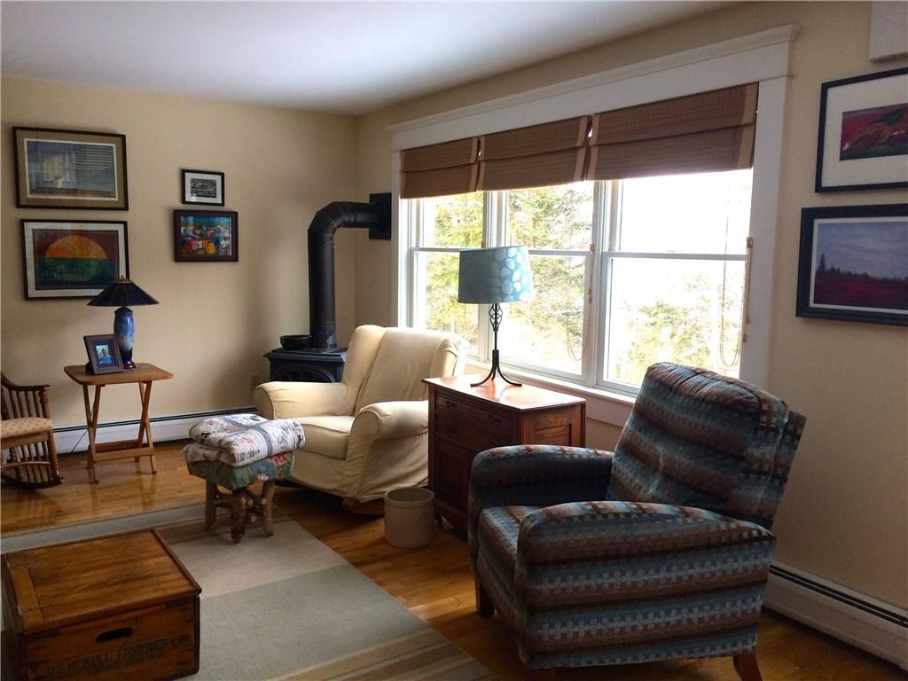 103 Shore Road Perry, ME 04667 - Photo 18 of 33 Living room - propane stove in corner