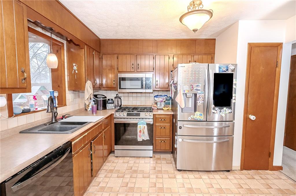 144 Stormer Road Indiana, PA 15701 - Photo 6 of 41 a kitchen with a sink stove and refrigerator