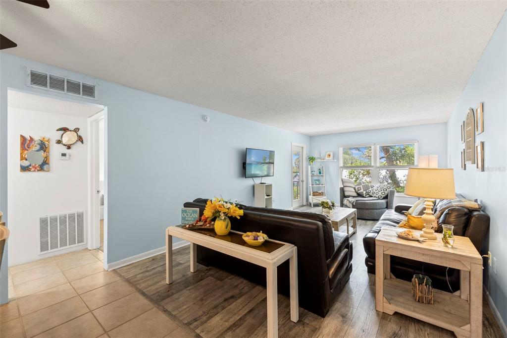 12760 Indian Rocks Road, Unit 107 Largo, FL 33774 - Photo 11 of 39 a view of a livingroom with furniture and a window
