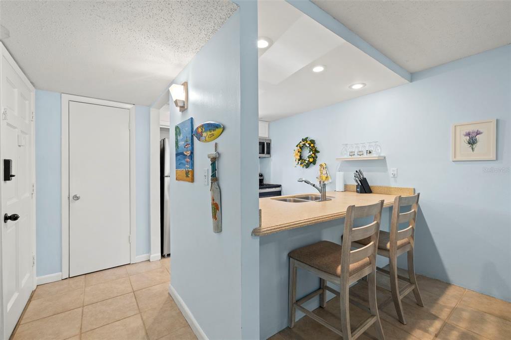 12760 Indian Rocks Road, Unit 107 Largo, FL 33774 - Photo 18 of 39 a view of kitchen dining table with chairs