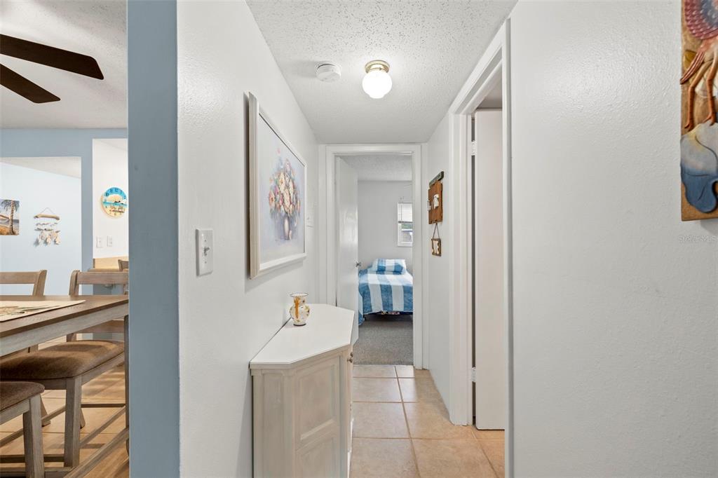 12760 Indian Rocks Road, Unit 107 Largo, FL 33774 - Photo 20 of 39 a en suite bathroom with a sink mirror and a bath tub