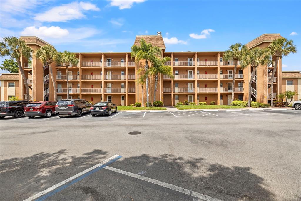 12760 Indian Rocks Road, Unit 107 Largo, FL 33774 - Photo 2 of 39 front view of a building with a street