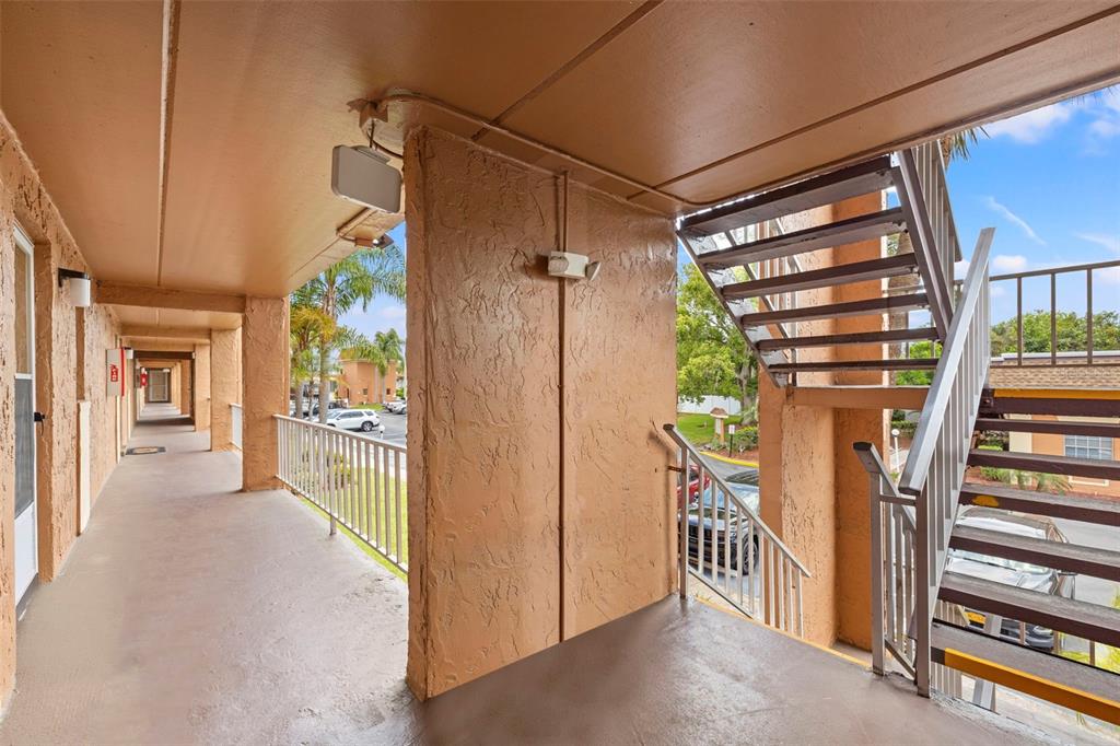 12760 Indian Rocks Road, Unit 107 Largo, FL 33774 - Photo 4 of 39 a view of a hallway to a livingroom with furniture