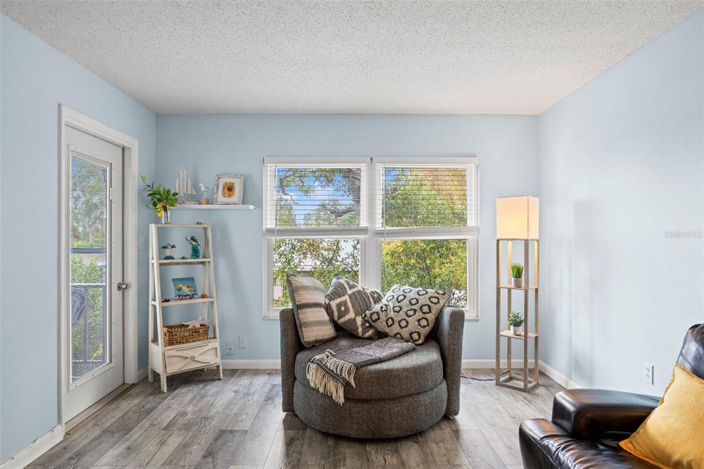 12760 Indian Rocks Road, Unit 107 Largo, FL 33774 - Photo 9 of 39 a living room with furniture and a window
