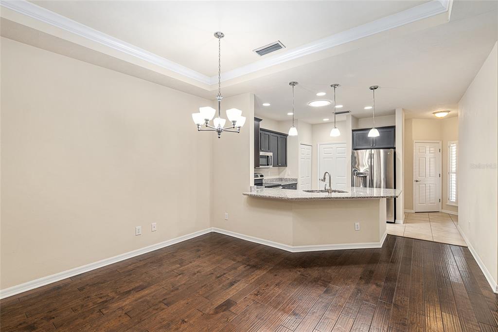 12731 Northwest 12th Road Newberry, FL 32669 - Photo 12 of 33 a view of a kitchen with a sink and a chandelier