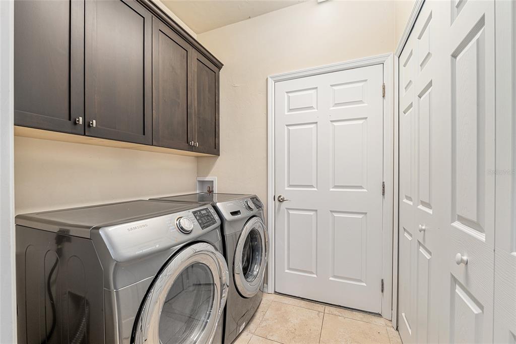12731 Northwest 12th Road Newberry, FL 32669 - Photo 16 of 33 a utility room with dryer and washer