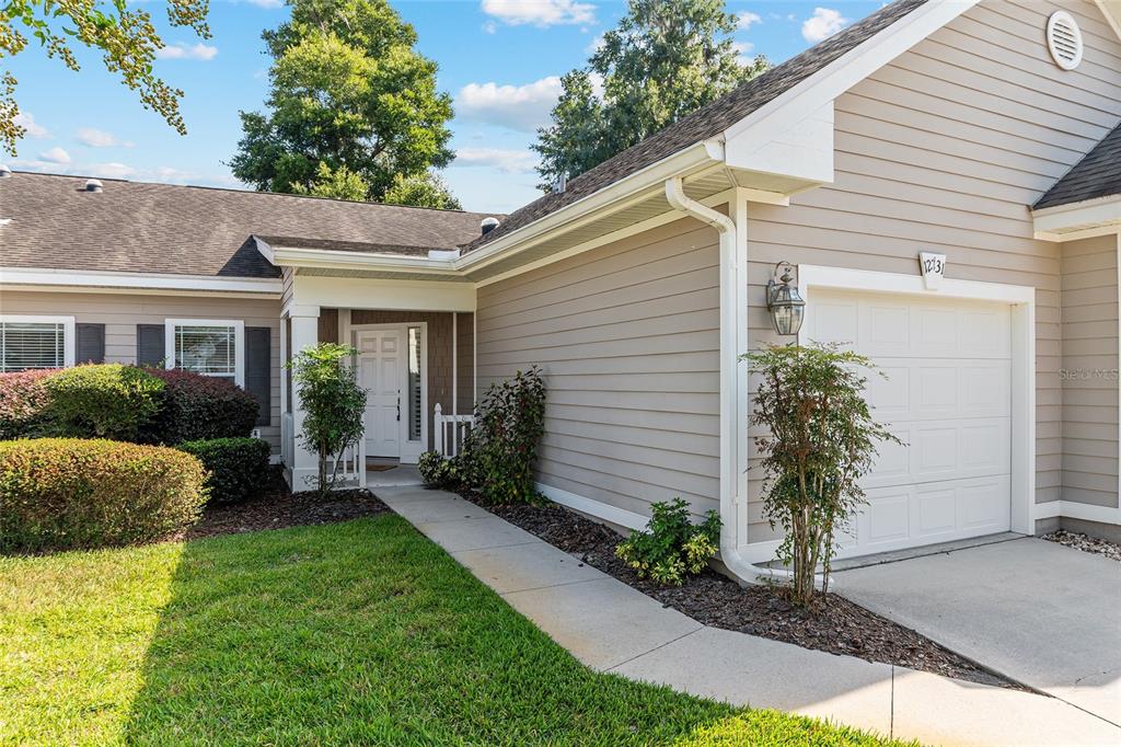12731 Northwest 12th Road Newberry, FL 32669 - Photo 2 of 33 a view of house with a yard and potted plants