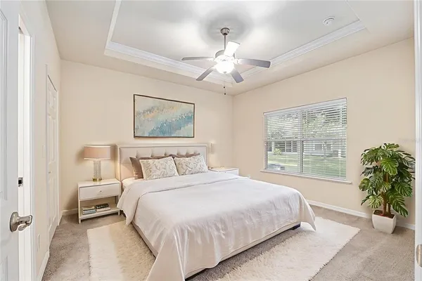 a bedroom with a large bed and a window