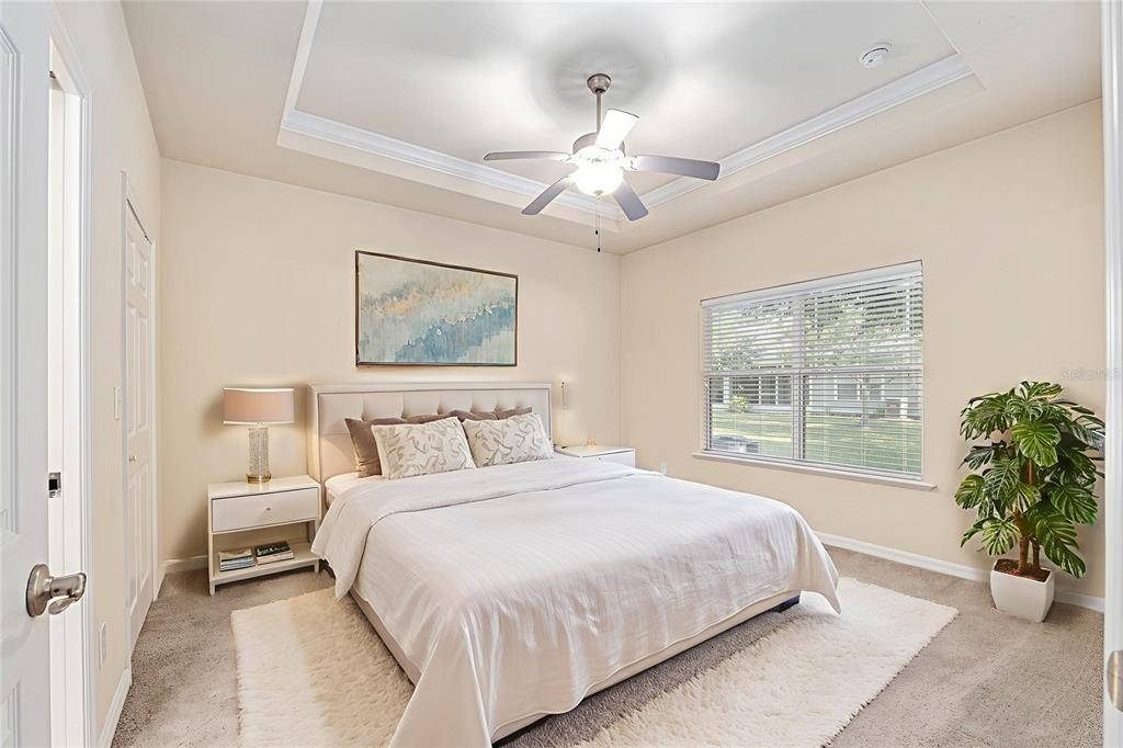 12731 Northwest 12th Road Newberry, FL 32669 - Photo 22 of 33 a bedroom with a large bed and a window