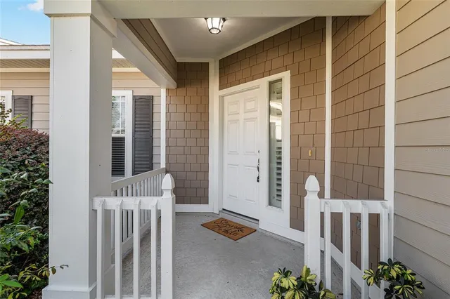 a balcony with furniture and potted plant