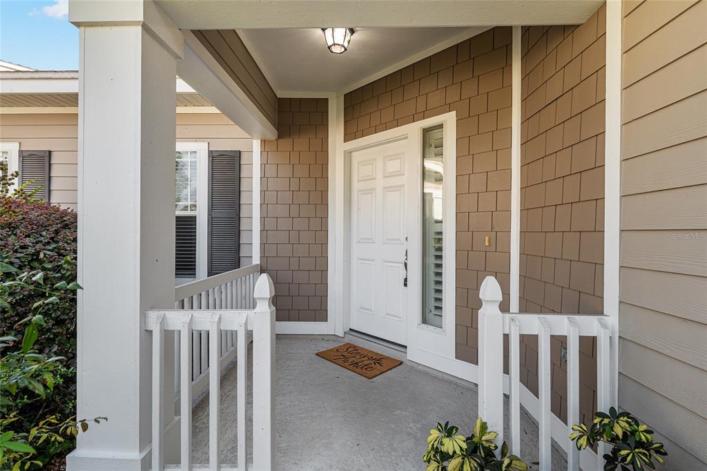 12731 Northwest 12th Road Newberry, FL 32669 - Photo 3 of 33 a balcony with furniture and potted plant