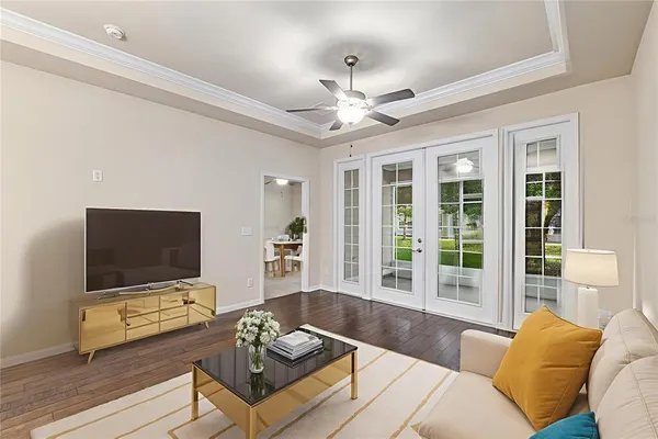a living room with furniture and a flat screen tv