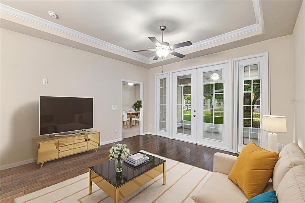 12731 Northwest 12th Road Newberry, FL 32669 - Photo 9 of 33 a living room with furniture and a flat screen tv
