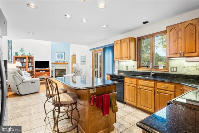 a large kitchen with granite countertop lots of counter top space