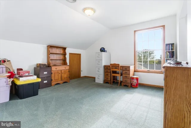 a room with furniture and gym equipment