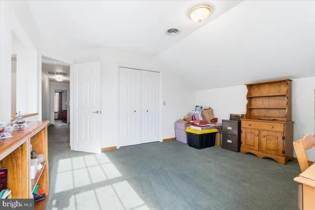 a bedroom with bed and a window