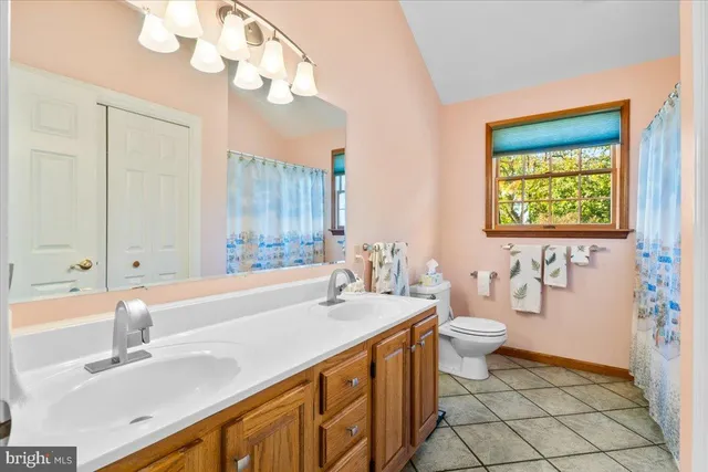 a bedroom with furniture and a book shelf