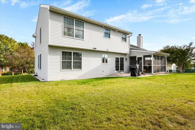 a front view of a house with a garden and porch
