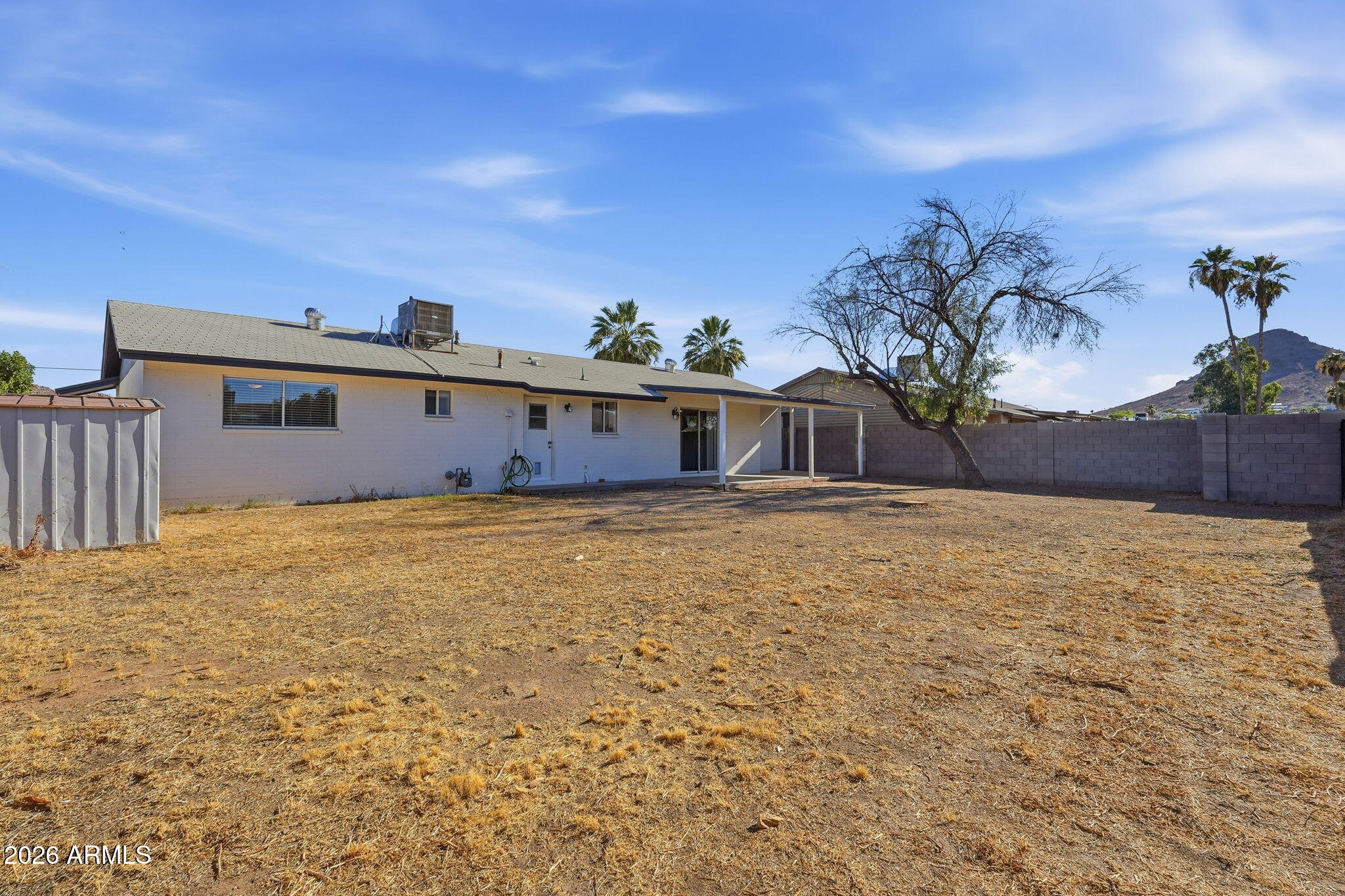 2302 East Nisbet Road Phoenix, AZ 85022 - Photo 22 of 22 a front view of a house with a yard
