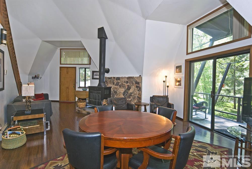 820 Hot Springs Road Markleeville, CA 96120 - Photo 20 of 36 a dining room with furniture a flat screen tv and a large window