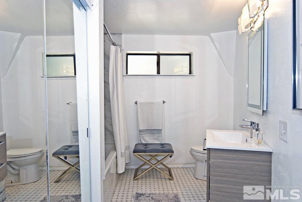 820 Hot Springs Road Markleeville, CA 96120 - Photo 26 of 36 a bathroom with a sink a toilet and mirror