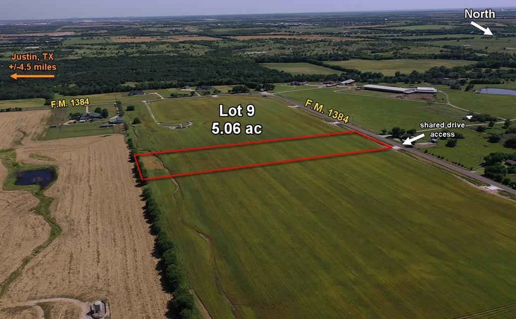 Aerial view of sparsely populated area featuring property parcel outlined