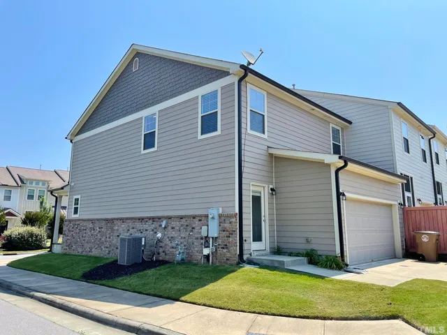 a view of multiple houses with a street